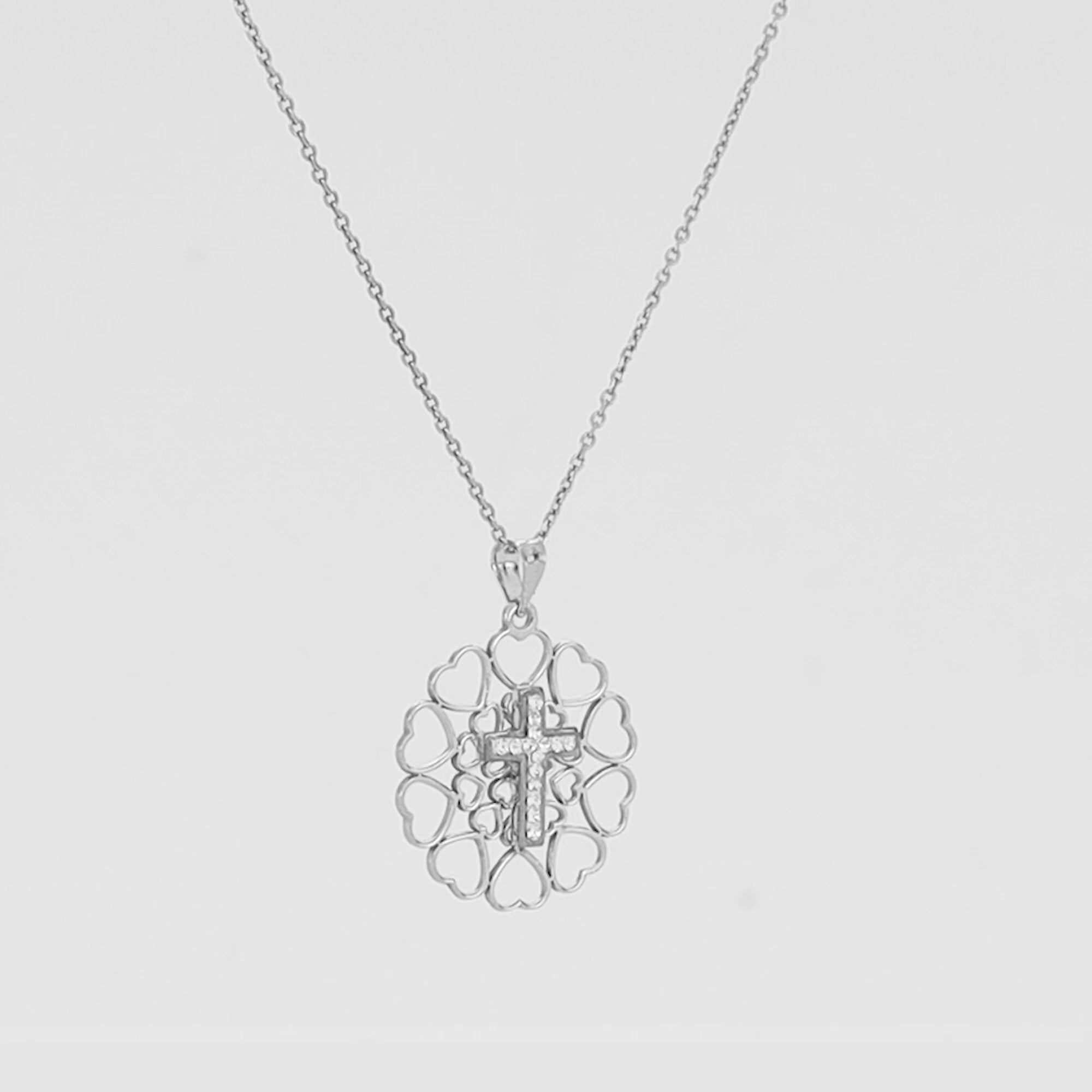 El colgante de cruz de cristal del amor